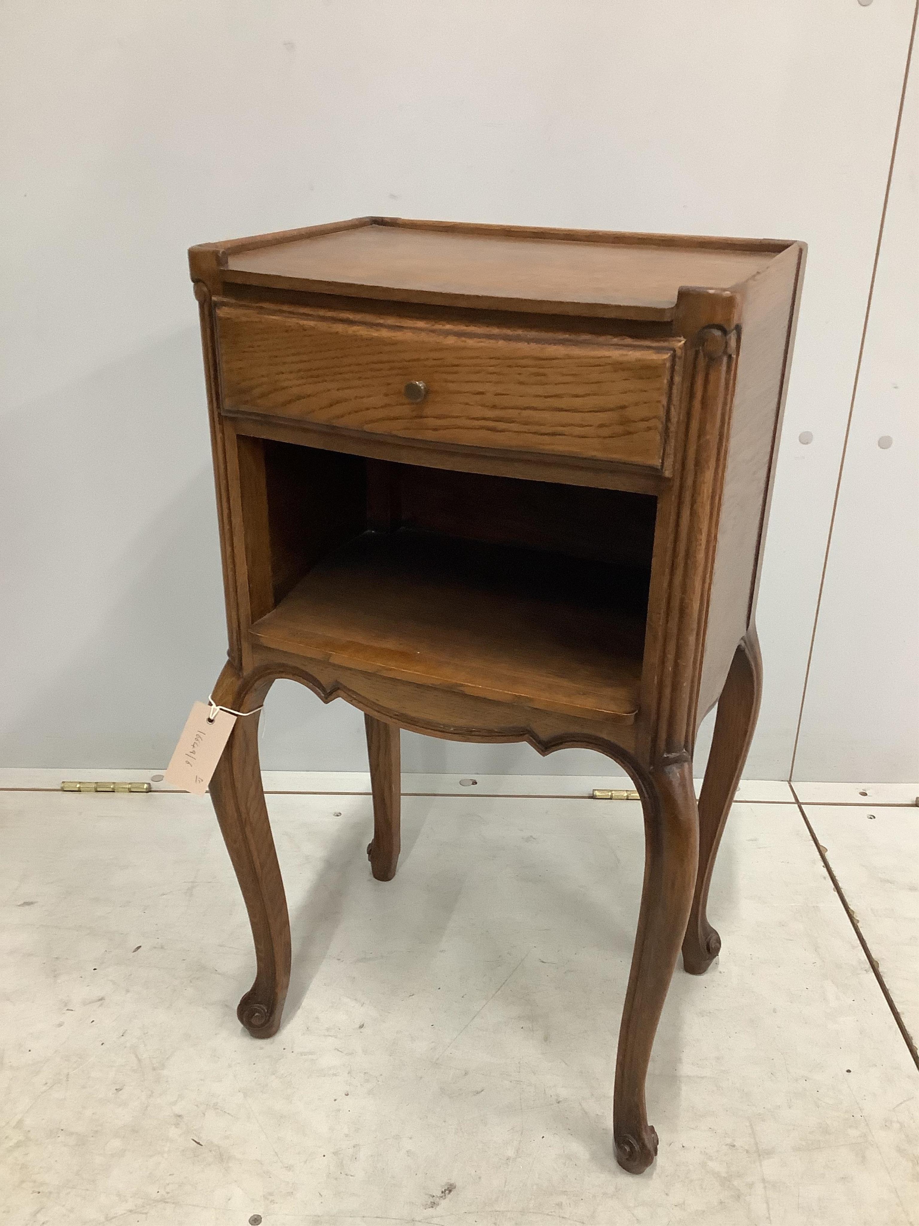 A pair of French oak bedside cabinets, width 38cm, depth 28cm, height 70cm. Condition - fair to good